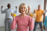 Getty - smiling with weights exercise fitness workout