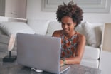 woman laptop smile business work from home-1200x800-5b2df79