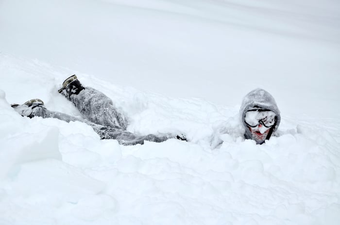 Person in a large snowbank.