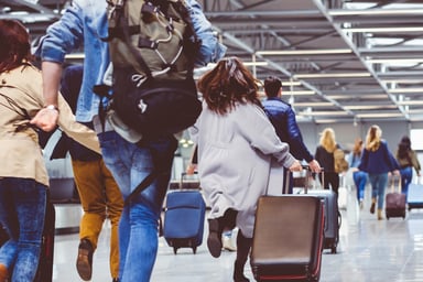 busy walking through airport travel vacation flights-1200x800-5b2df79