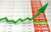 One green arrow sticks out of a list of stock prices that are all red