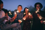 People with sparklers at a party