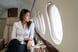 plane woman private jet first class travel business