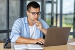 investor with laptop and pen 1445006678