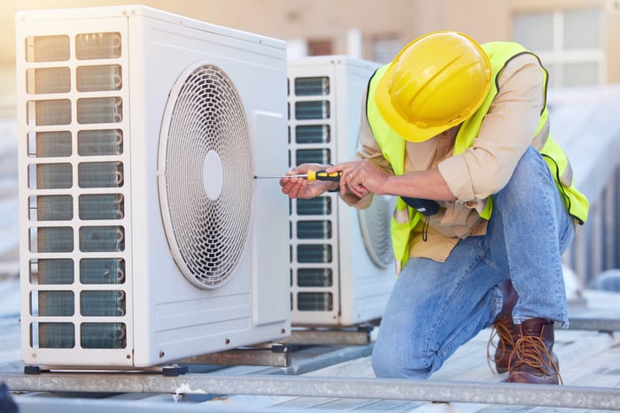 A technician working on an HVAC system.