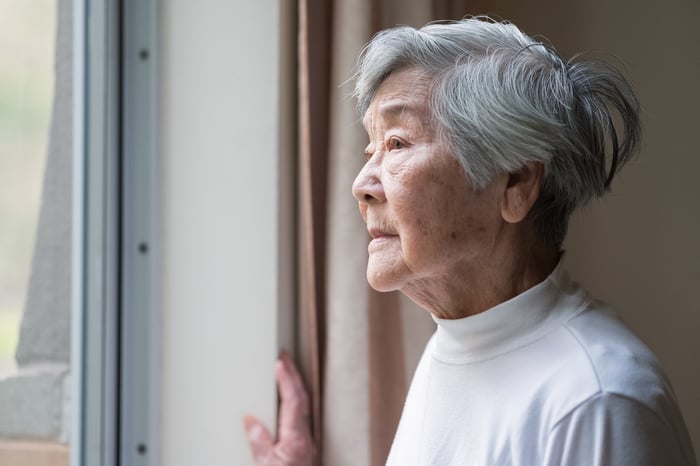 Person looking out a window.