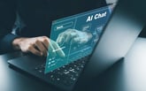 A person using a chatbot on their laptop.