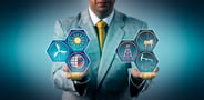 A person holding energy industry icons in their hands.
