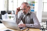 Senior man laptop GettyImages-1157094435