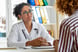 Physician talking to patient.