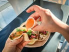 Pouring dressing on a wrap