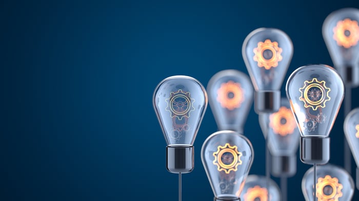 Several lightbulb with luminous gears inside.