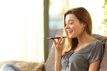 speaking into smartphone voice assistant siri artificial intelligence ai 9b9f185
