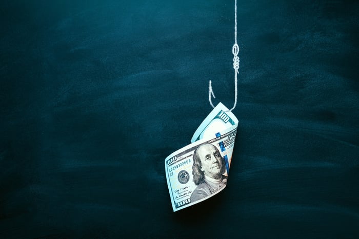 Money on a fishing hook.