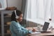 person-headphones-writing