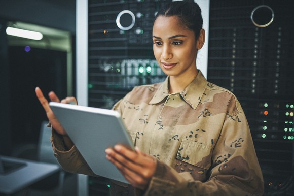 A soldier uses a tablet computer.
