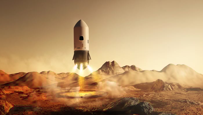 Artist's depiction of a rocket landing tail-first on Mars.