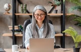 Older woman laptop smiling GettyImages-1304724400