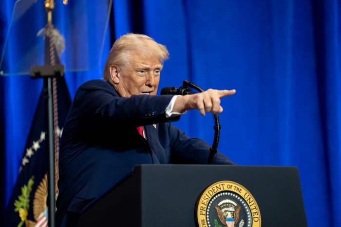 Donald Trump pointing with his finger while giving remarks at the Department of Justice.