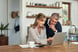 A couple looking at a computer screen.