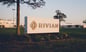 building with _rivian logo sign on front lawn_rivian_