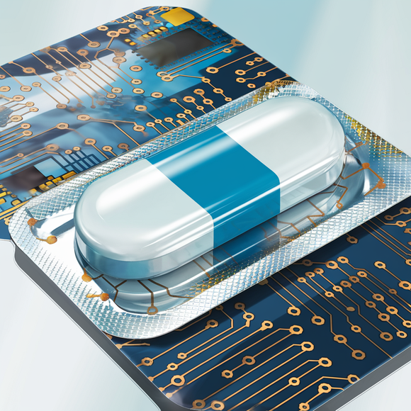 A pill still in a foil package sitting on top of a semiconductor chip.