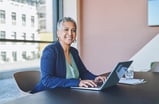 woman 50s laptop GettyImages-1414393948