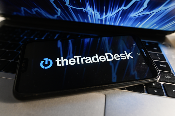 The Trade Desk corporate logo displayed on a smartphone.