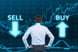 graph businessman considering to buy or sell stocks