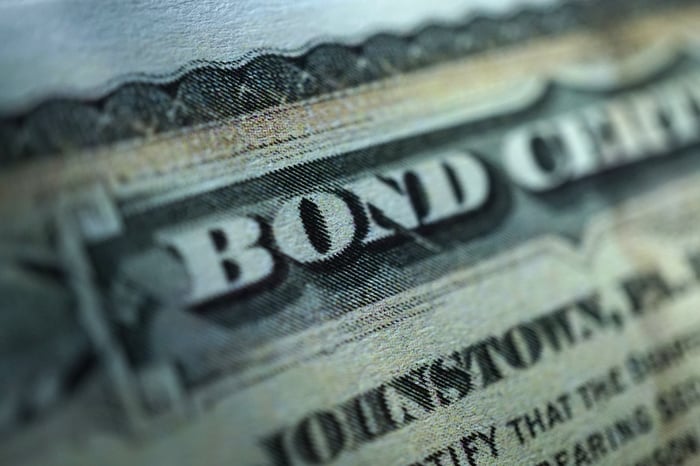 An up-close view of a paper bond certificate.