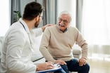 Patient talking with a physician.