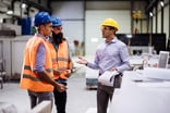 three people in a warehouse