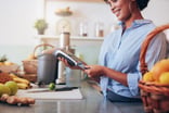 A person using a point of sale device