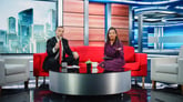 Newscasters in a studio