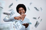 Person with stack of dollar bills