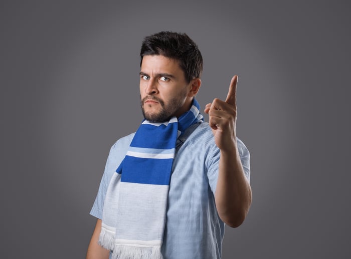 Someone is looking at the camera and glaring with a finger pointed -- as if warning the viewer.