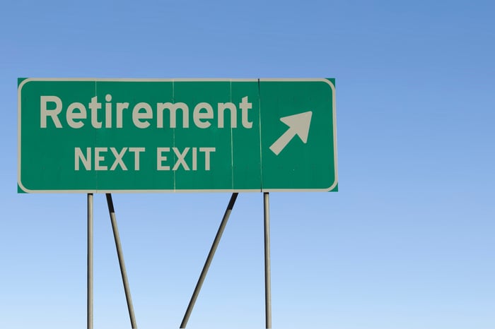 A road sign that reads retirement next exit with an arrow.