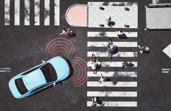 Autonomous driving vehicle sensing pedestrians.