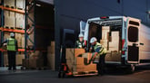 People unloading a delivery truck