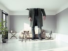 22_05_25 A giant person breaking through the ceiling of a living room _GettyImages-1089786990