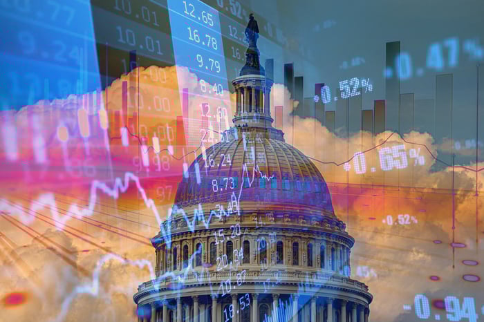The dome of the U.S. Capitol is superimposed on a stock chart and a board depicting stock prices.