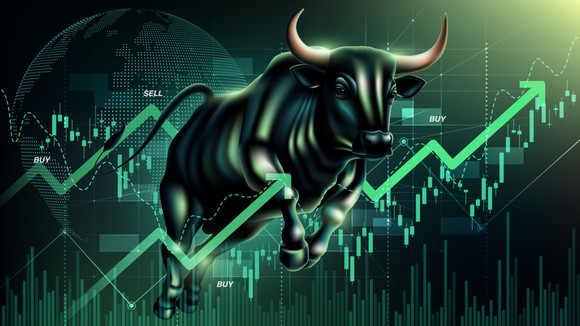 A green bull running through a stock chart.