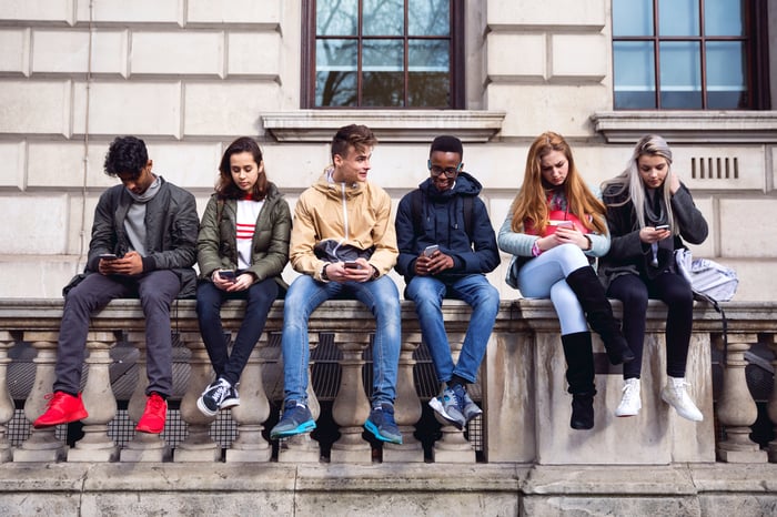 Students looking at phones.