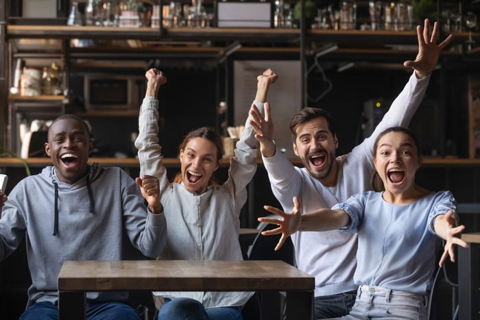 Group of people cheering.