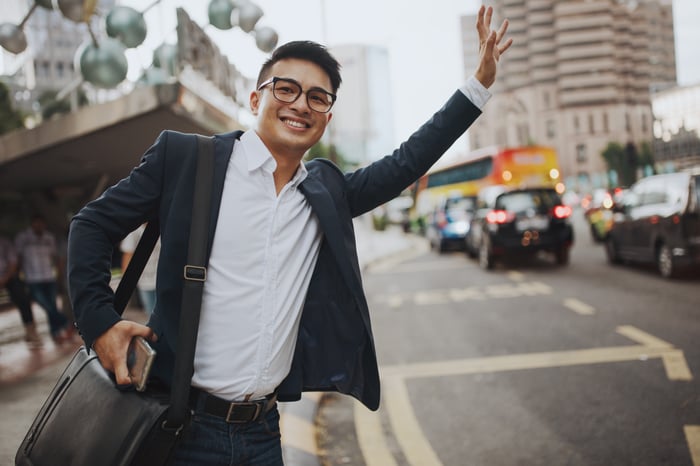 Asian Man Hailing a Ride