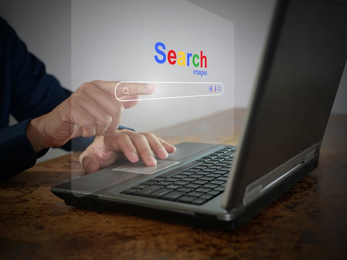 The word Search hovering over a laptop.