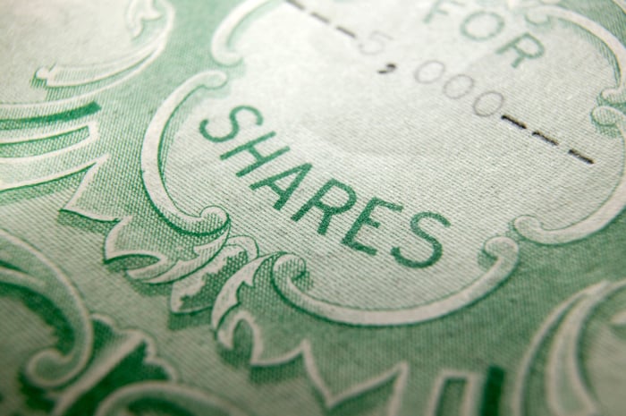 A paper stock certificate for shares of a publicly traded company.