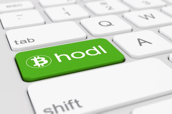 Bitcoin hodl keyboard button in green.