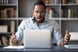 22_01_26 A person looking at a computer screen with a look of unpleasant surprise _GettyImages-1216968860