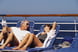 a couple lounging on a cruise ship